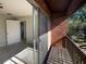 Balcony with brick and wood railing overlooking a patio at 5126 Picadilly Circus Ct # 11, Orlando, FL 32839