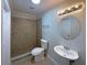 Well-maintained bathroom featuring a walk-in shower and modern fixtures at 5126 Picadilly Circus Ct # 11, Orlando, FL 32839