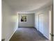 Spacious bedroom features neutral carpeting, double closets, and a bright window view at 5126 Picadilly Circus Ct # 11, Orlando, FL 32839