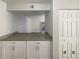 Bright kitchen with granite countertops and a breakfast bar opening to the living area at 5126 Picadilly Circus Ct # 11, Orlando, FL 32839