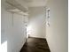 Laundry room featuring wood floors and shelving at 5126 Picadilly Circus Ct # 11, Orlando, FL 32839