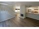 Inviting living room featuring hardwood floors, fireplace, and an open layout to the kitchen at 5126 Picadilly Circus Ct # 11, Orlando, FL 32839