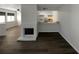 Open concept living area featuring a fireplace and kitchen with breakfast bar seating at 5126 Picadilly Circus Ct # 11, Orlando, FL 32839