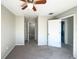 Comfortable main bedroom featuring a ceiling fan, neutral colors, and access to ensuite bathroom at 5126 Picadilly Circus Ct # 11, Orlando, FL 32839