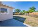 A spacious backyard with a privacy fence and mature trees at 5600 Arundel Dr, Orlando, FL 32808