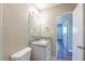 This bathroom features a granite vanity and modern mirror at 5600 Arundel Dr, Orlando, FL 32808
