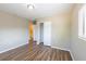 An updated bedroom featuring hard surface flooring, with ensuite bathroom access at 5600 Arundel Dr, Orlando, FL 32808