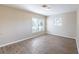 A cozy bedroom that receives natural light through two windows, creating a warm and inviting space at 5600 Arundel Dr, Orlando, FL 32808