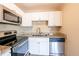 Featuring a stainless steel dishwasher, oven, and microwave, this kitchen has everything you need! at 5600 Arundel Dr, Orlando, FL 32808