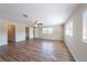Spacious living room with new floors, lots of light, and a ceiling fan at 5600 Arundel Dr, Orlando, FL 32808
