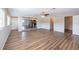 Open-concept living space with modern flooring and seamless flow to the kitchen at 5600 Arundel Dr, Orlando, FL 32808