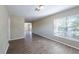 Bright living room with updated floors and natural light, offering a view into the next room at 5600 Arundel Dr, Orlando, FL 32808