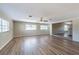 Inviting living room with wood-look floors, a ceiling fan, and an open layout at 5600 Arundel Dr, Orlando, FL 32808