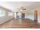 Bright living room featuring wood-look floors and an open view to the kitchen at 5600 Arundel Dr, Orlando, FL 32808