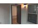 Unit 204 front door, exterior light fixture, open door to inside and a window at 625 Dory Ln # 204, Altamonte Springs, FL 32714