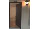 View of unit 204 front door, exterior light fixture, and an open door to view inside at 625 Dory Ln # 204, Altamonte Springs, FL 32714