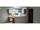 Cozy kitchen with white cabinets, tile backsplash, and modern appliances at 625 Dory Ln # 204, Altamonte Springs, FL 32714