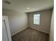 Cozy carpeted bedroom with a bright window, perfect for relaxation at 628 Pothos St, Apopka, FL 32703