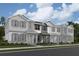 Charming townhomes feature Hardie siding, decorative shutters, and welcoming front porches at 628 Pothos St, Apopka, FL 32703