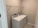 Bright laundry room with a washing machine and dryer ready for chores at 628 Pothos St, Apopka, FL 32703