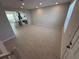 Spacious living room with tile flooring, neutral walls, and recessed lighting at 628 Pothos St, Apopka, FL 32703