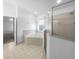 Bathroom featuring a soaking tub, separate shower, and tiled flooring for a luxurious feel at 640 Westview Dr, Minneola, FL 34715