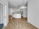 Open dining room with kitchen view and sliding glass door at 640 Westview Dr, Minneola, FL 34715