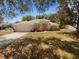 Charming single-story home featuring a two-car garage and mature landscaping with trees offering ample shade at 640 Westview Dr, Minneola, FL 34715