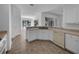 Well-lit kitchen with ample counter space and an open layout, adjacent to a dining area at 640 Westview Dr, Minneola, FL 34715
