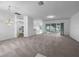 Bright living room with open floor plan and sliding glass doors at 640 Westview Dr, Minneola, FL 34715