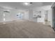 Spacious living area featuring neutral colors with a seamless flow to dining area and kitchen at 640 Westview Dr, Minneola, FL 34715