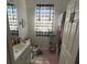 Bright bathroom featuring a shower, a vanity with sink, and modern finishes at 6434 Cava Alta Dr # 303, Orlando, FL 32835