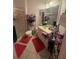 Compact bathroom with a shower, single vanity, and colorful accents at 6434 Cava Alta Dr # 303, Orlando, FL 32835