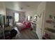 Bright bedroom featuring wood floors, natural light, and decorative accents at 6434 Cava Alta Dr # 303, Orlando, FL 32835