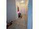 Inviting entryway featuring tiled flooring and a stylish console table with artwork at 6434 Cava Alta Dr # 303, Orlando, FL 32835