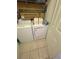 Functional laundry area featuring a stacked washer and dryer, perfect for convenience at 6434 Cava Alta Dr # 303, Orlando, FL 32835