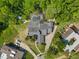 Stunning aerial view of the property showcasing the home's expansive layout, pool, and lush landscaping at 677 Benitawood Ct, Winter Springs, FL 32708