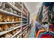 Spacious walk-in closet featuring extensive shelving for shoes and hanging rods for clothing at 677 Benitawood Ct, Winter Springs, FL 32708