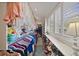 Walk-in closet with ample hanging space, shelving, and window offering natural light at 677 Benitawood Ct, Winter Springs, FL 32708