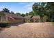 Circular brick driveway with ample parking leading to the attached garage at 677 Benitawood Ct, Winter Springs, FL 32708