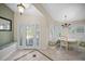 Welcoming foyer with patterned tile floor, leaded glass door, and built-in bench seating at 677 Benitawood Ct, Winter Springs, FL 32708