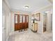 Inviting foyer with decorative tile, wood door, and views into the living spaces at 677 Benitawood Ct, Winter Springs, FL 32708