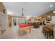 Large game room with pool table, bar area, and access to the backyard at 677 Benitawood Ct, Winter Springs, FL 32708