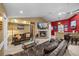 Cozy living room featuring a fireplace, comfortable seating, and natural light at 677 Benitawood Ct, Winter Springs, FL 32708