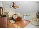 Large main bedroom with vaulted ceilings, wood floors, and a walk-in closet at 677 Benitawood Ct, Winter Springs, FL 32708