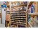 This large wine cellar features racks and shelves for bottles of wine, beer, and other alcoholic beverages at 677 Benitawood Ct, Winter Springs, FL 32708