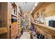This large wine cellar features racks and shelves for bottles of wine, beer, and other alcoholic beverages at 677 Benitawood Ct, Winter Springs, FL 32708