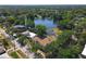 Aerial shot of the apartments near a serene lake and lush greenery, with neighborhood streets visible at 702 E Church St # 3, Orlando, FL 32801