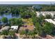 Aerial shot showing the apartments and a serene lake surrounded by lush greenery and roadways at 702 E Church St # 3, Orlando, FL 32801