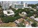Aerial view of apartments amidst greenery, set against the backdrop of a vibrant cityscape at 702 E Church St # 3, Orlando, FL 32801